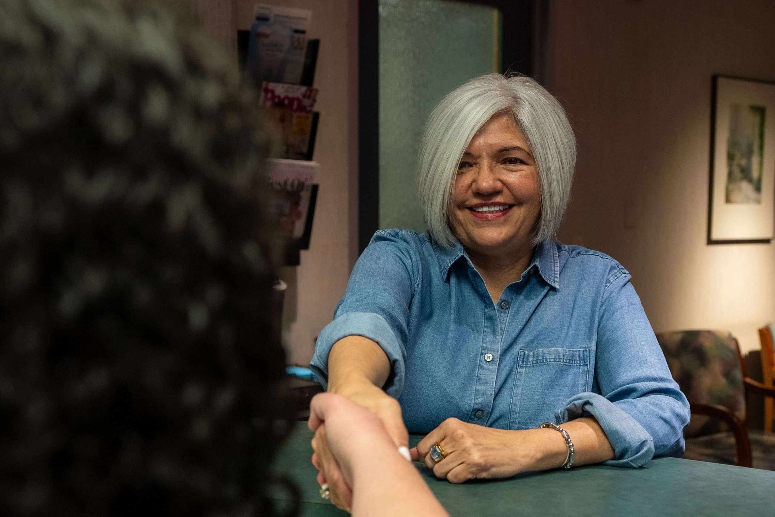 Dr. Gerald Marlin adjusting a dental prosthesis for optimal fit