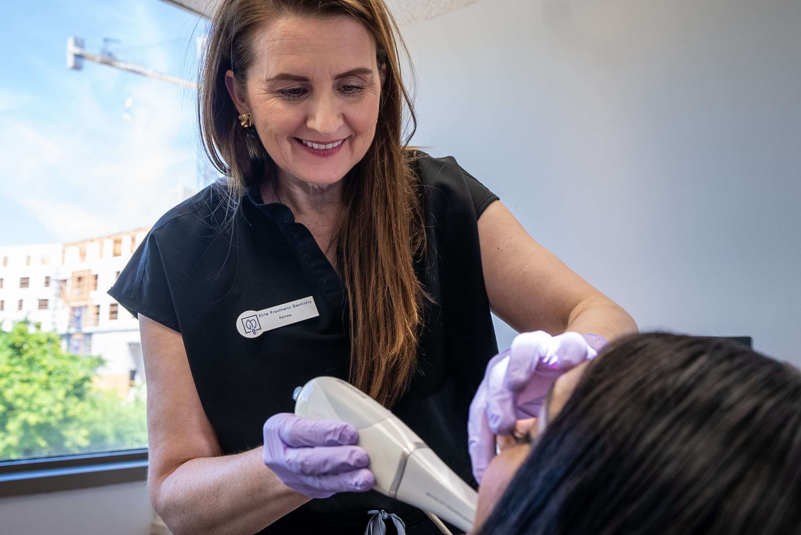 Dr. Gerald Marlin crafting a custom dental restoration in the in-house lab