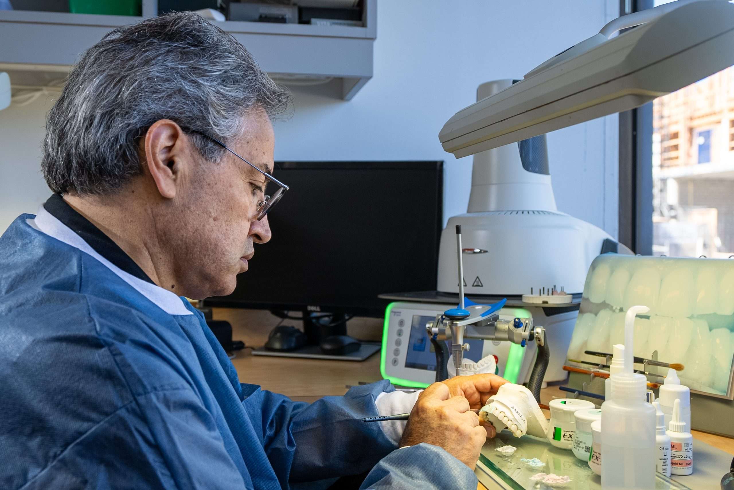 Dr. Gerald Marlin working on a dental restoration in the clinical suite