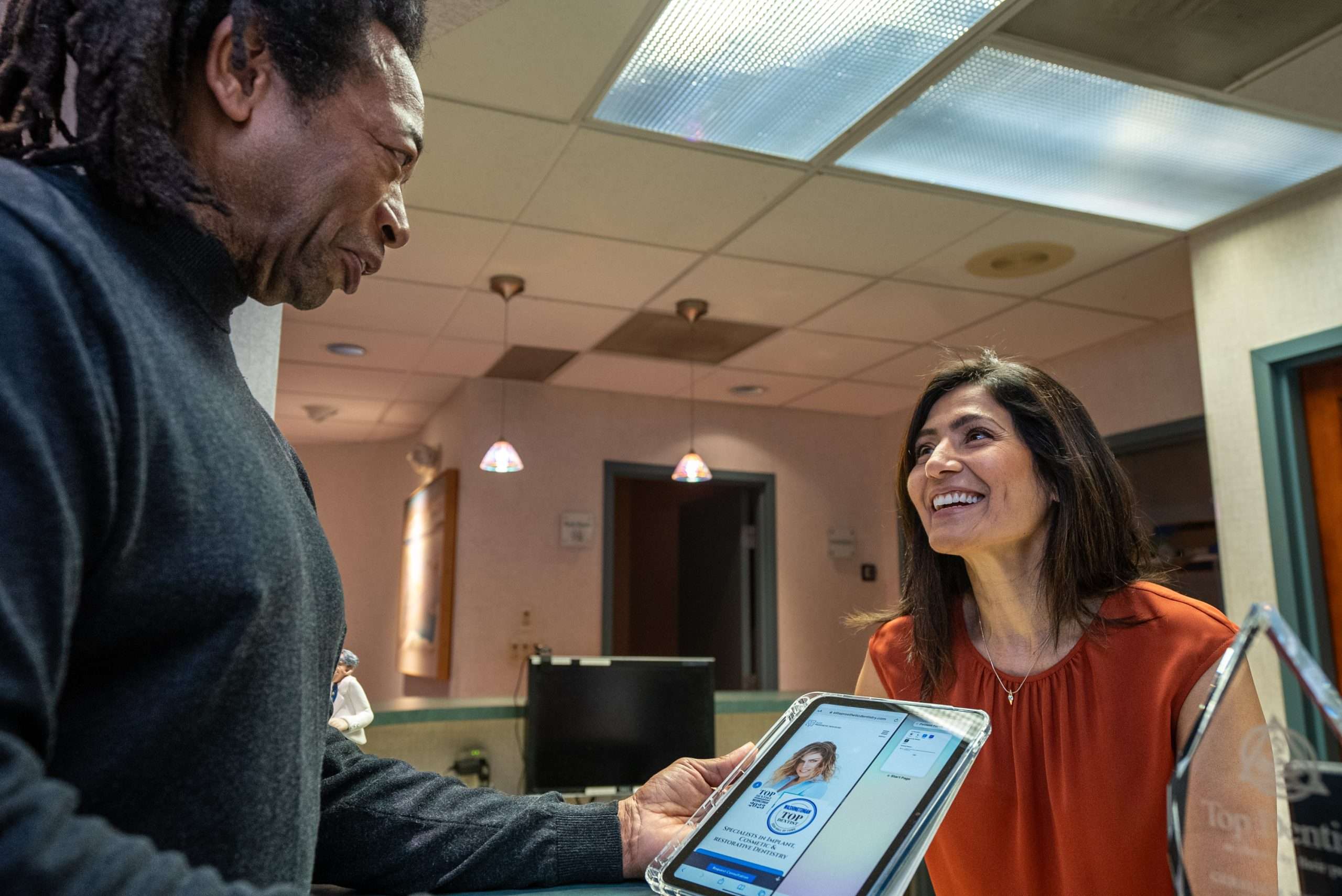 Dr. Gerald Marlin reviewing a digital dental restoration design