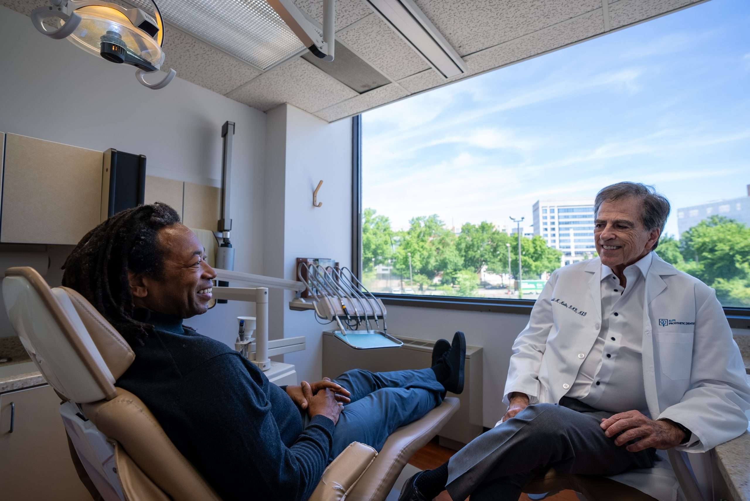 Dr. Gerald Marlin reviewing a denture design with the dental lab team