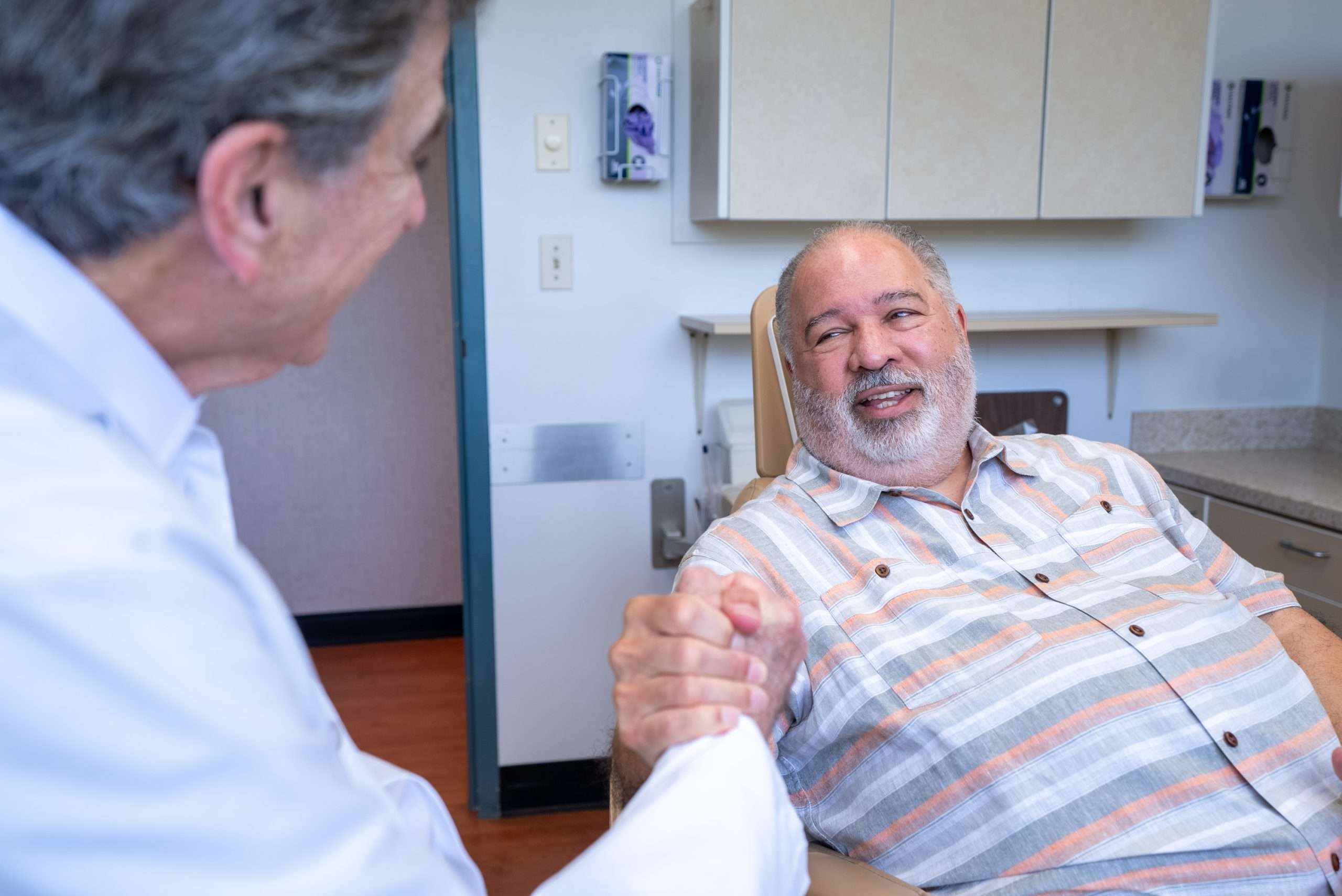Dr. Gerald Marlin fitting a custom denture for a patient